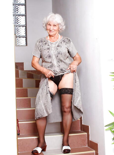 Seductive grandma Betty in hot underwear baring big boobies and loving sex toy 